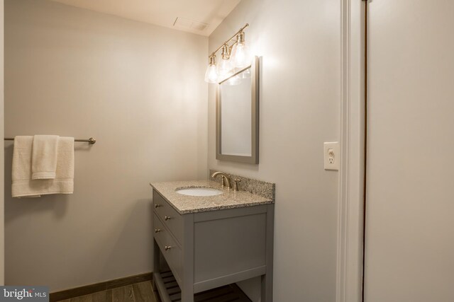 3706 Bestpitch Ferry Rd, Cambridge, MD 21613 - bathroom featuring vanity, wood finished floors, and baseboards