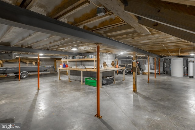 3706 Bestpitch Ferry Rd, Cambridge, MD 21613 - unfinished basement with gas water heater and a workshop area