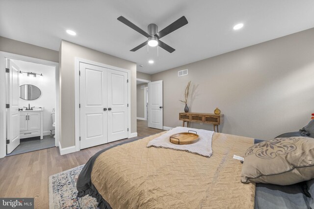 20 Hathaway Dr, Princeton Junction, NJ 08550 - bedroom featuring wood finished floors, a sink, baseboards, a closet, and recessed lighting