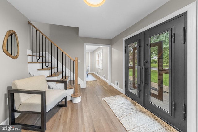 20 Hathaway Dr, Princeton Junction, NJ 08550 - foyer entrance with french doors, baseboards, wood finished floors, and stairway