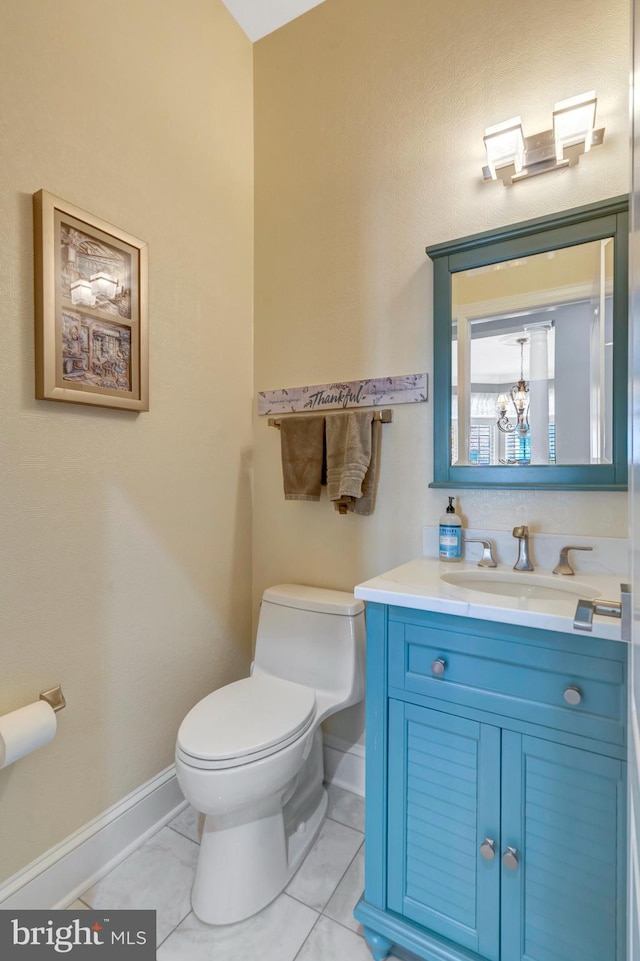 12723 Lady Somerset Ln, Fairfax, VA 22033 - bathroom with baseboards, toilet, vanity, and a chandelier