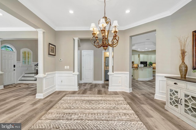 12723 Lady Somerset Ln, Fairfax, VA 22033 - entryway with a chandelier, light wood-type flooring, crown molding, recessed lighting, and wainscoting