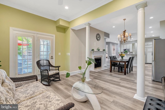 12723 Lady Somerset Ln, Fairfax, VA 22033 - living room featuring ornate columns, light wood finished floors, baseboards, a fireplace with flush hearth, and recessed lighting