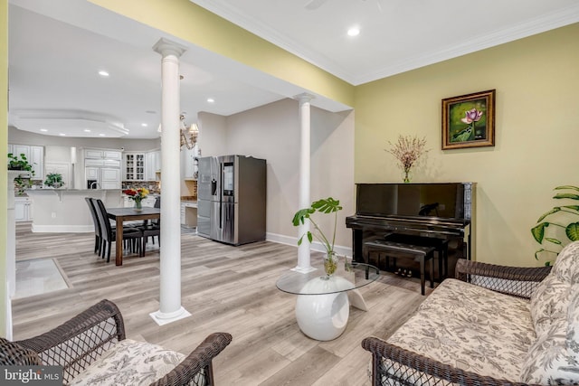 12723 Lady Somerset Ln, Fairfax, VA 22033 - living room featuring ornate columns, light wood-style flooring, crown molding, recessed lighting, and baseboards