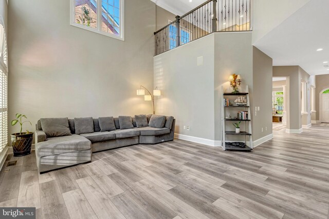 12723 Lady Somerset Ln, Fairfax, VA 22033 - living area featuring a high ceiling, wood finished floors, baseboards, ornate columns, and recessed lighting