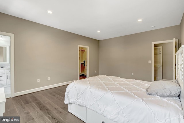 12723 Lady Somerset Ln, Fairfax, VA 22033 - bedroom featuring wood finished floors, a walk in closet, recessed lighting, baseboards, and ensuite bath