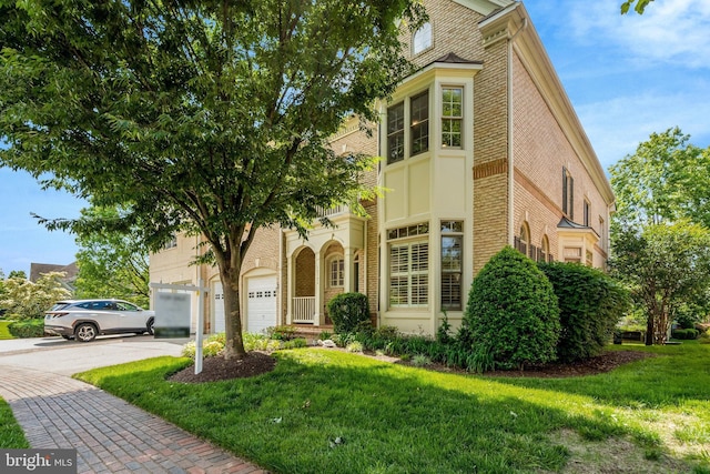 12723 Lady Somerset Ln, Fairfax, VA 22033 - view of front facade with brick siding, driveway, a front yard, and an attached garage