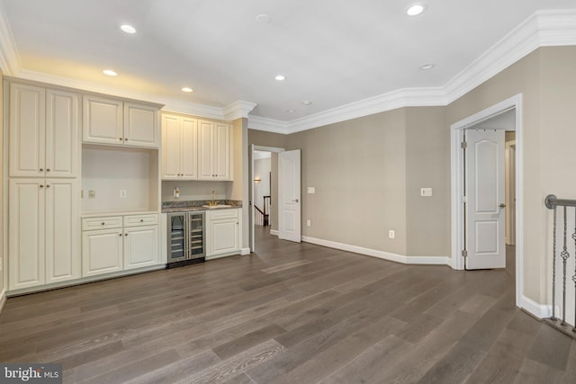 12723 Lady Somerset Ln, Fairfax, VA 22033 - kitchen with beverage cooler, dark wood-type flooring, a sink, crown molding, and baseboards