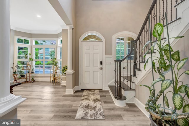 12723 Lady Somerset Ln, Fairfax, VA 22033 - foyer featuring decorative columns, stairway, wood finished floors, crown molding, and baseboards