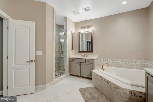 12723 Lady Somerset Ln, Fairfax, VA 22033 - bathroom featuring vanity, a garden tub, marble finish floors, a stall shower, and recessed lighting