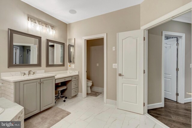 12723 Lady Somerset Ln, Fairfax, VA 22033 - full bathroom featuring vanity, marble finish flooring, baseboards, and toilet