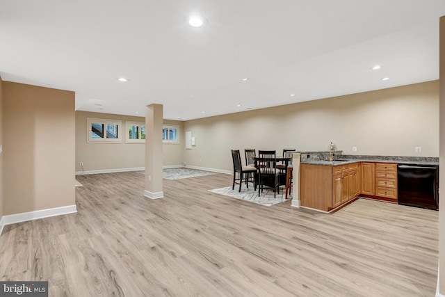 12723 Lady Somerset Ln, Fairfax, VA 22033 - kitchen with black dishwasher, light wood-type flooring, open floor plan, a peninsula, and a sink