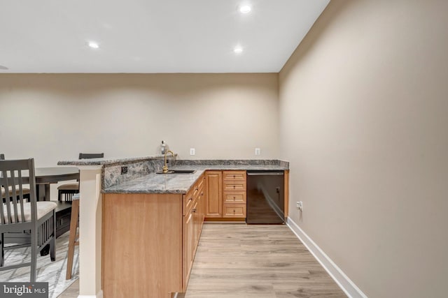 12723 Lady Somerset Ln, Fairfax, VA 22033 - kitchen with dishwashing machine, a sink, light wood-type flooring, stone countertops, and recessed lighting