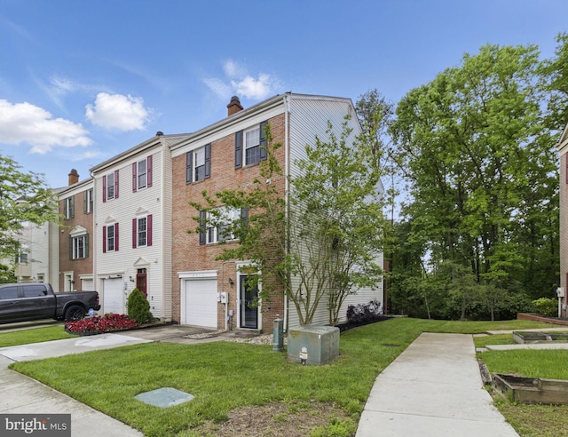 9213 Fairlane Pl, Laurel, MD 20708 - view of building exterior featuring driveway and a garage