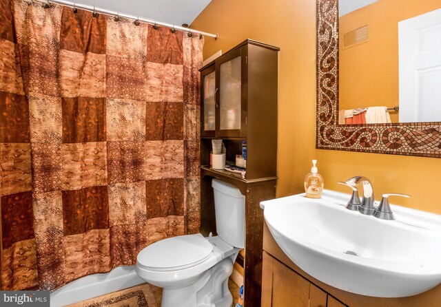 9213 Fairlane Pl, Laurel, MD 20708 - bathroom featuring toilet, curtained shower, and vanity