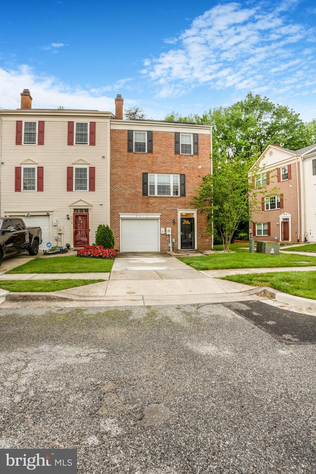 9213 Fairlane Pl, Laurel, MD 20708 - view of front of house featuring a chimney, driveway, a garage, brick siding, and a front yard