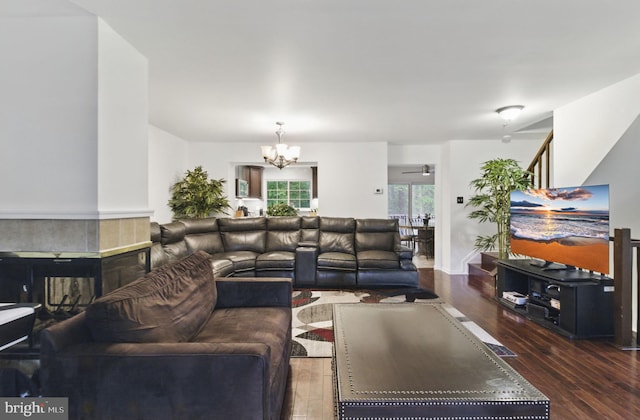 9213 Fairlane Pl, Laurel, MD 20708 - living area featuring wood finished floors, a chandelier, and a tile fireplace