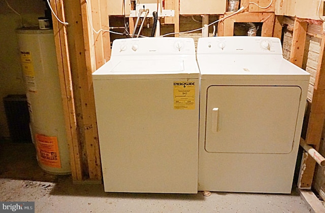 laundry area featuring washing machine and clothes dryer and gas water heater