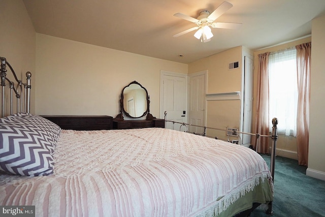 663 Tomlin Station Rd, Mullica Hill, NJ 08062 - bedroom with dark carpet, baseboards, and a ceiling fan