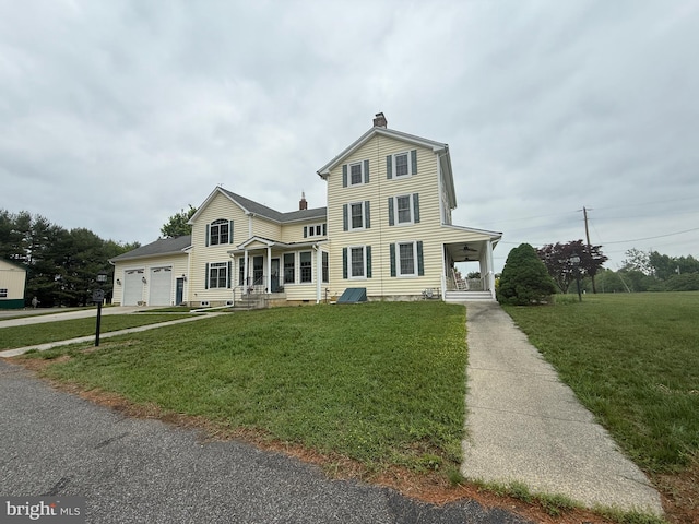 663 Tomlin Station Rd, Mullica Hill, NJ 08062 - traditional-style house with a chimney, a front lawn, an attached garage, and driveway