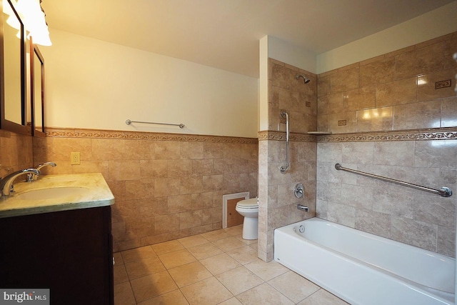 663 Tomlin Station Rd, Mullica Hill, NJ 08062 - bathroom with toilet, vanity, tile patterned floors, tub / shower combination, and tile walls
