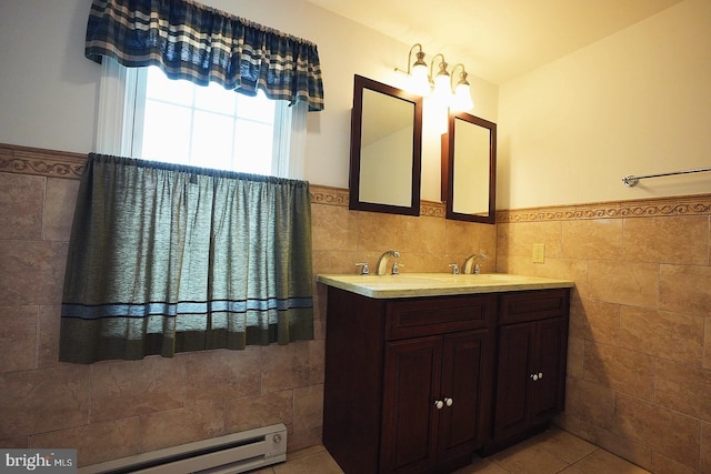 663 Tomlin Station Rd, Mullica Hill, NJ 08062 - bathroom featuring tile walls, wainscoting, double vanity, tile patterned flooring, and baseboard heating