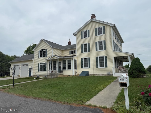 663 Tomlin Station Rd, Mullica Hill, NJ 08062 - traditional-style home with a chimney, a front lawn, covered porch, an attached garage, and driveway
