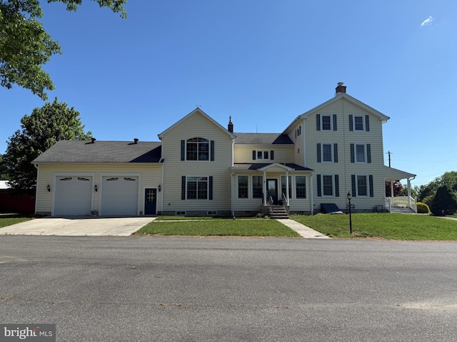 663 Tomlin Station Rd, Mullica Hill, NJ 08062 - view of front of house featuring an attached garage, a chimney, driveway, a front lawn, and crawl space