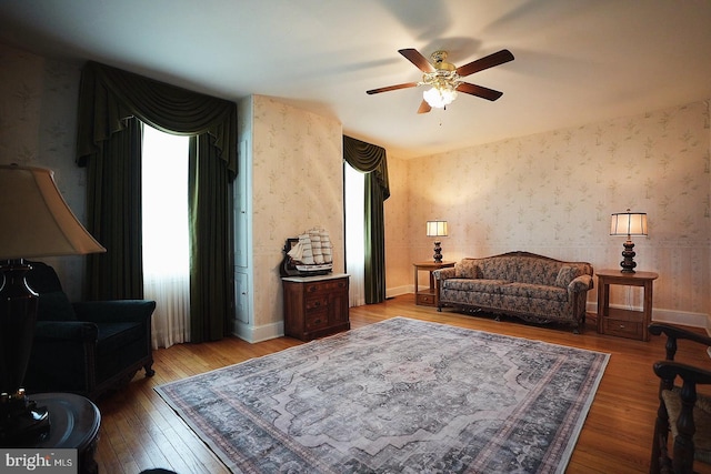 663 Tomlin Station Rd, Mullica Hill, NJ 08062 - living room featuring wallpapered walls, a ceiling fan, hardwood / wood-style floors, and baseboards