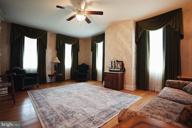 663 Tomlin Station Rd, Mullica Hill, NJ 08062 - living room with wallpapered walls, ceiling fan, plenty of natural light, and hardwood / wood-style flooring