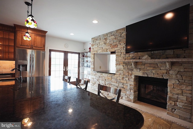 663 Tomlin Station Rd, Mullica Hill, NJ 08062 - dining space with french doors, a fireplace, and recessed lighting