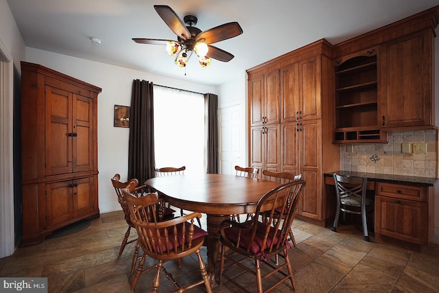 663 Tomlin Station Rd, Mullica Hill, NJ 08062 - dining room featuring stone finish flooring and ceiling fan