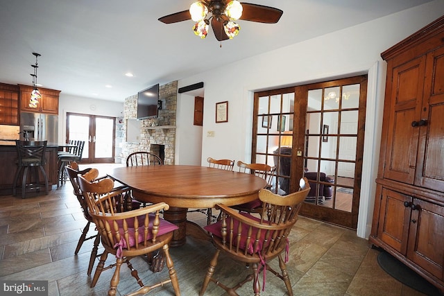 663 Tomlin Station Rd, Mullica Hill, NJ 08062 - dining room featuring french doors, ceiling fan, a stone fireplace, and recessed lighting