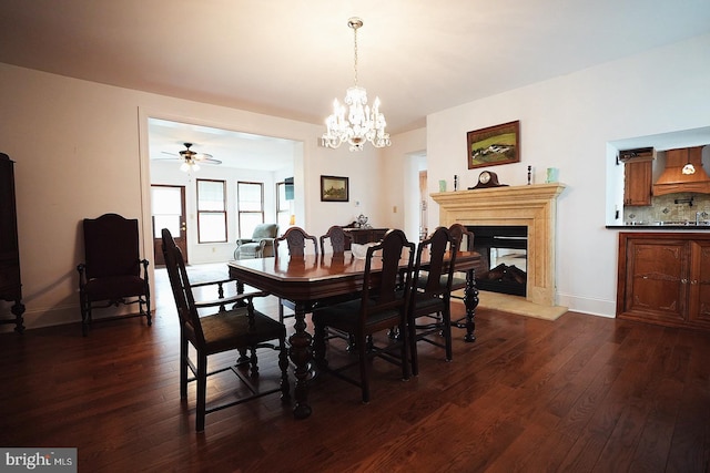 663 Tomlin Station Rd, Mullica Hill, NJ 08062 - dining area featuring a ceiling fan, a chandelier, dark wood finished floors, a multi sided fireplace, and baseboards