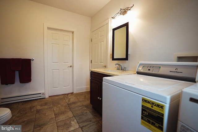 663 Tomlin Station Rd, Mullica Hill, NJ 08062 - laundry area featuring washer / clothes dryer, baseboard heating, and stone finish floors