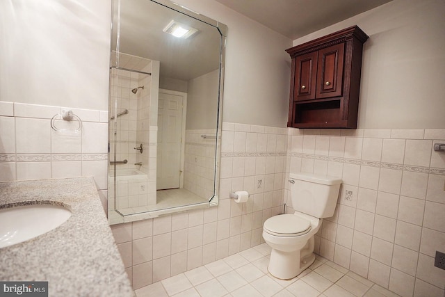 663 Tomlin Station Rd, Mullica Hill, NJ 08062 - full bath with tile walls, tile patterned flooring, toilet, a tile shower, and vanity