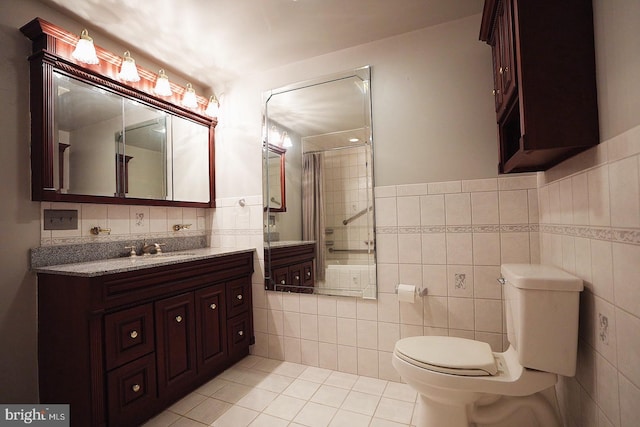 663 Tomlin Station Rd, Mullica Hill, NJ 08062 - full bath with tile walls, tile patterned floors, toilet, vanity, and a tile shower