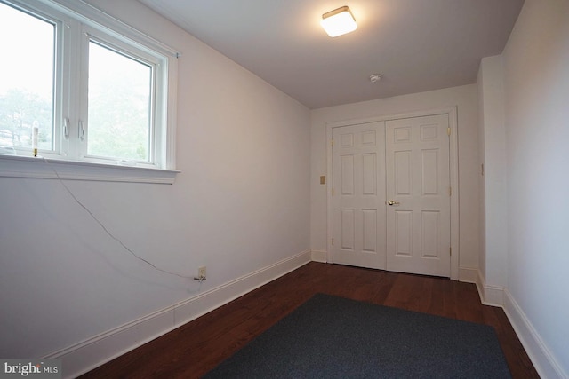 663 Tomlin Station Rd, Mullica Hill, NJ 08062 - unfurnished bedroom featuring dark wood-type flooring, baseboards, and a closet