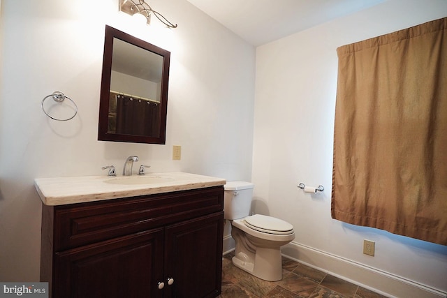 663 Tomlin Station Rd, Mullica Hill, NJ 08062 - bathroom with baseboards, vanity, and toilet