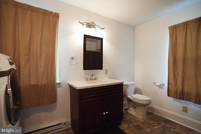 663 Tomlin Station Rd, Mullica Hill, NJ 08062 - bathroom with a baseboard radiator, baseboards, vanity, toilet, and washer / dryer