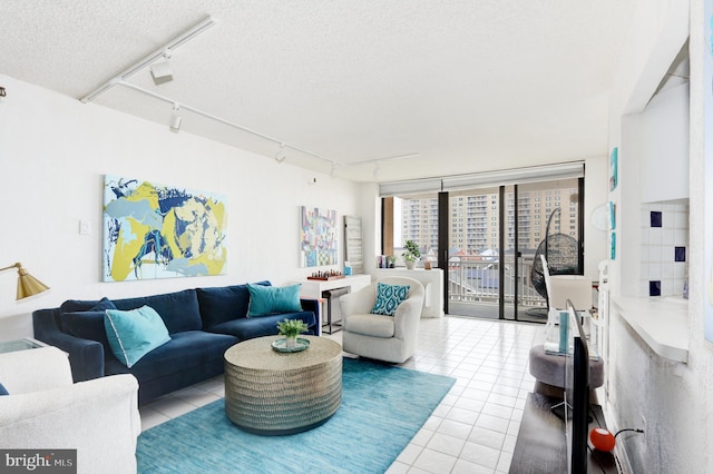 5200 Boardwalk, Ventnor City, NJ 08406 - tiled living area featuring rail lighting and a textured ceiling