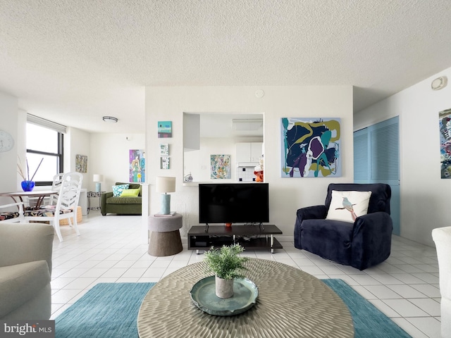 5200 Boardwalk, Ventnor City, NJ 08406 - tiled living room featuring a textured ceiling