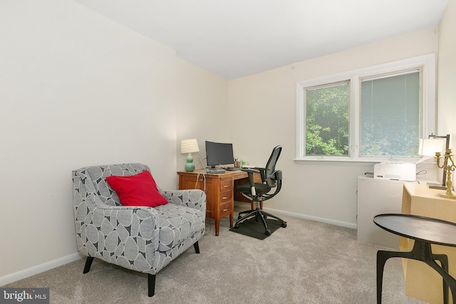 carpeted home office with baseboards