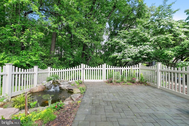 view of patio with a fenced front yard