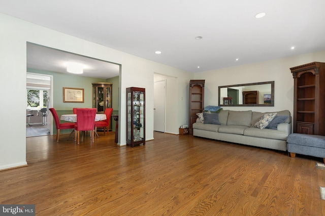 living area with wood finished floors, recessed lighting, and baseboards