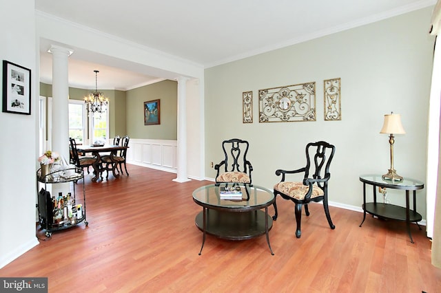15420 Cedarhurst Ct, Centreville, VA 20120 - living area with decorative columns, a chandelier, wood finished floors, and ornamental molding