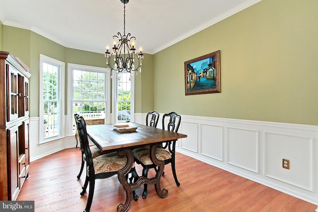 15420 Cedarhurst Ct, Centreville, VA 20120 - dining space featuring a chandelier, plenty of natural light, light wood-style floors, ornamental molding, and wainscoting