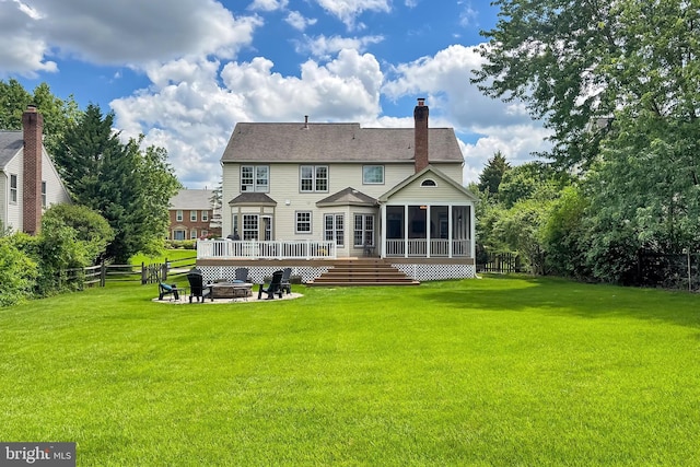 15420 Cedarhurst Ct, Centreville, VA 20120 - back of property with an outdoor fire pit, a sunroom, a chimney, and a deck