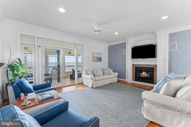 1417 Royal Way, Montross, VA 22520 - living area with crown molding, ceiling fan, wood finished floors, recessed lighting, and a tiled fireplace