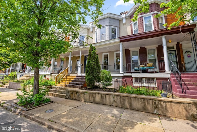 326 E 28th St, Baltimore, MD 21218 - multi unit property with a porch and brick siding